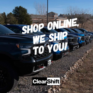 Trucks parked in the ClearShift lot, promoting online shopping and vehicle delivery.