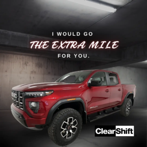Red GMC pickup truck with the message “I would go the Extra Mile for you,” themed for Valentine’s Day.