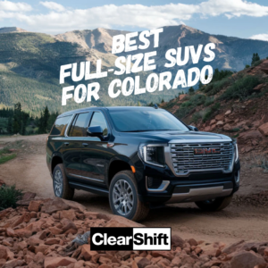 Black GMC Yukon driving across rugged mountain terrain, showcasing full-size SUV capability in Colorado.