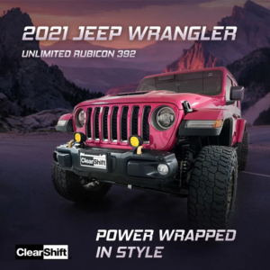 Front view of a pink Jeep Wrangler Rubicon displayed against a scenic mountain background, highlighting its bold style and off-road capability.
